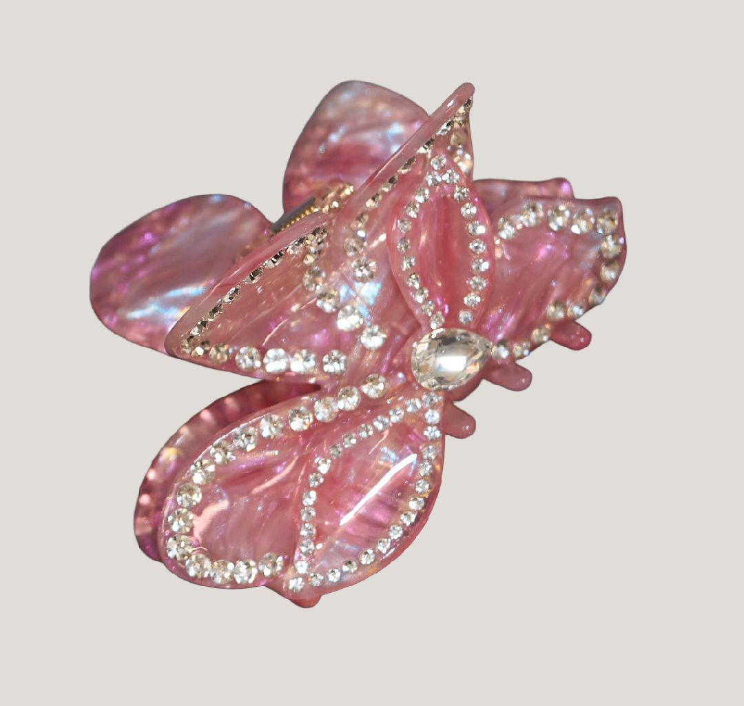 Half-up half-down hairstyle with a pink butterfly claw clip